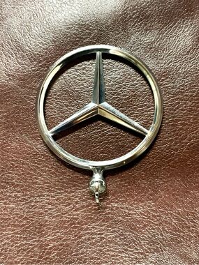 vintage Mercedes-Benz round grille badge / hood star emblem with a chrome-finish